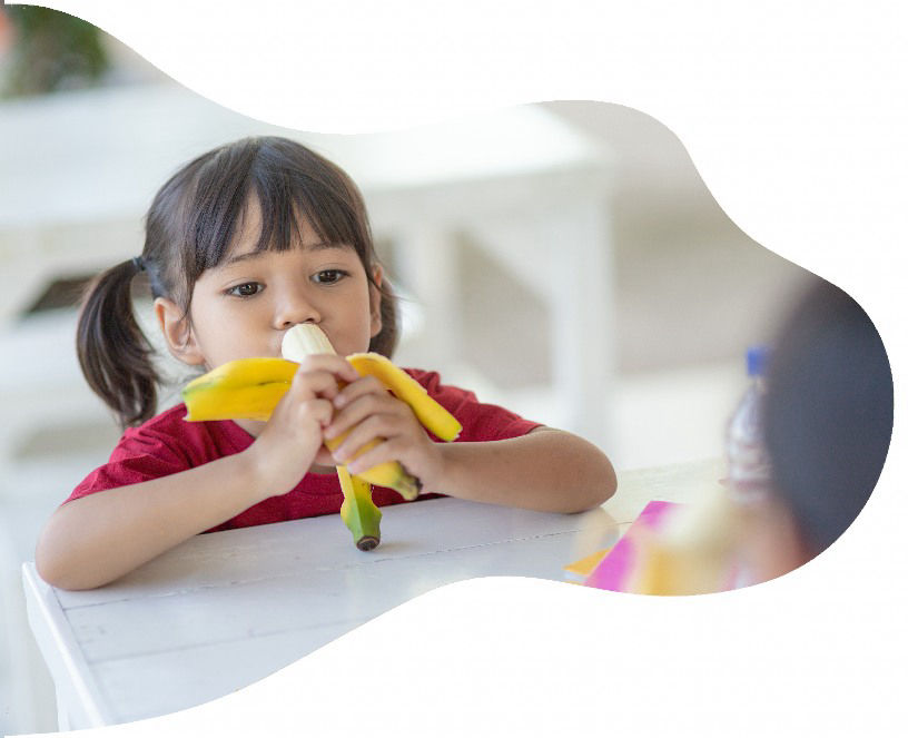 Child enjoying a healthy snack at GloryBer's