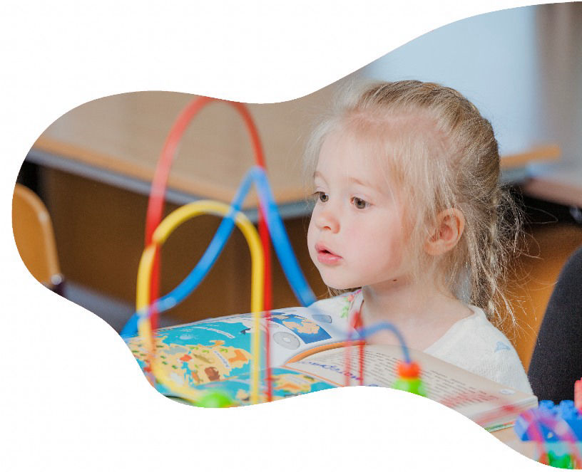 Child engaged in learning at GloryBer's