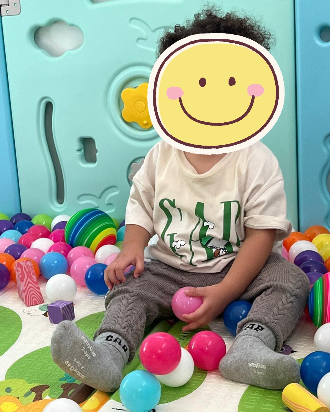 Child playing in ball pit